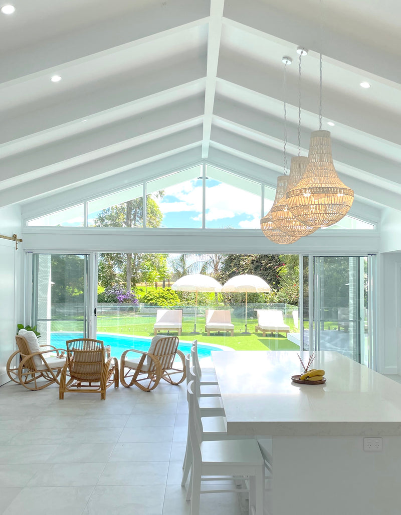 large white pendant lights in a coastal home