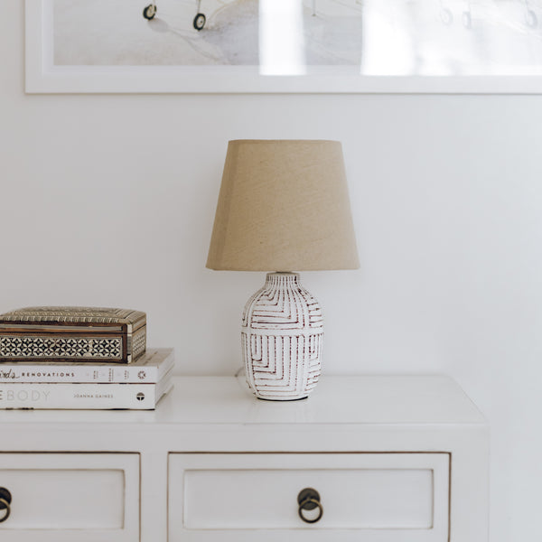 Kai table lamp with natural linen shade, styled on hallway table.