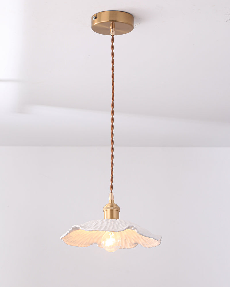 Pleated ceramic pendant light with brass gold fixture. 
