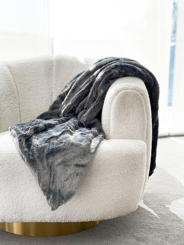 Soft, faux fur charcoal blanket with a luxurious texture and warmth