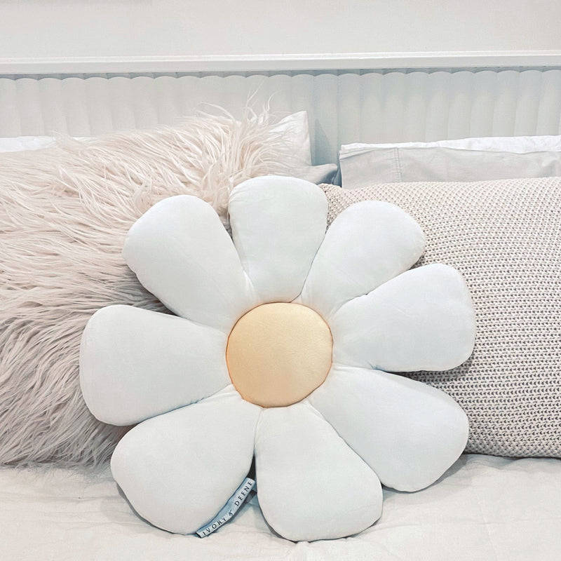 Soft white daisy-designed cushion for kids, ideal for brightening up a child's bedroom or play area.