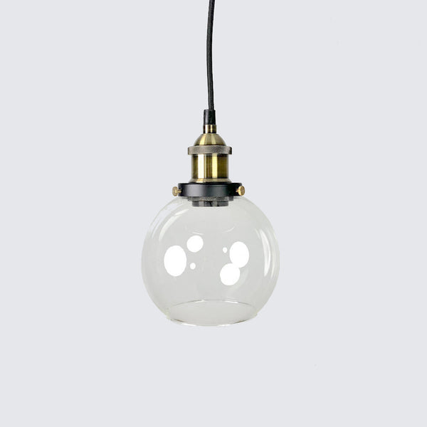 Elegant glass pendant light with sleek brass fittings, ideal for modern and contemporary interiors