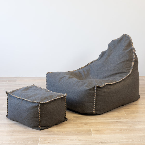 charcoal linen beanbag with ottoman on a wooden floor