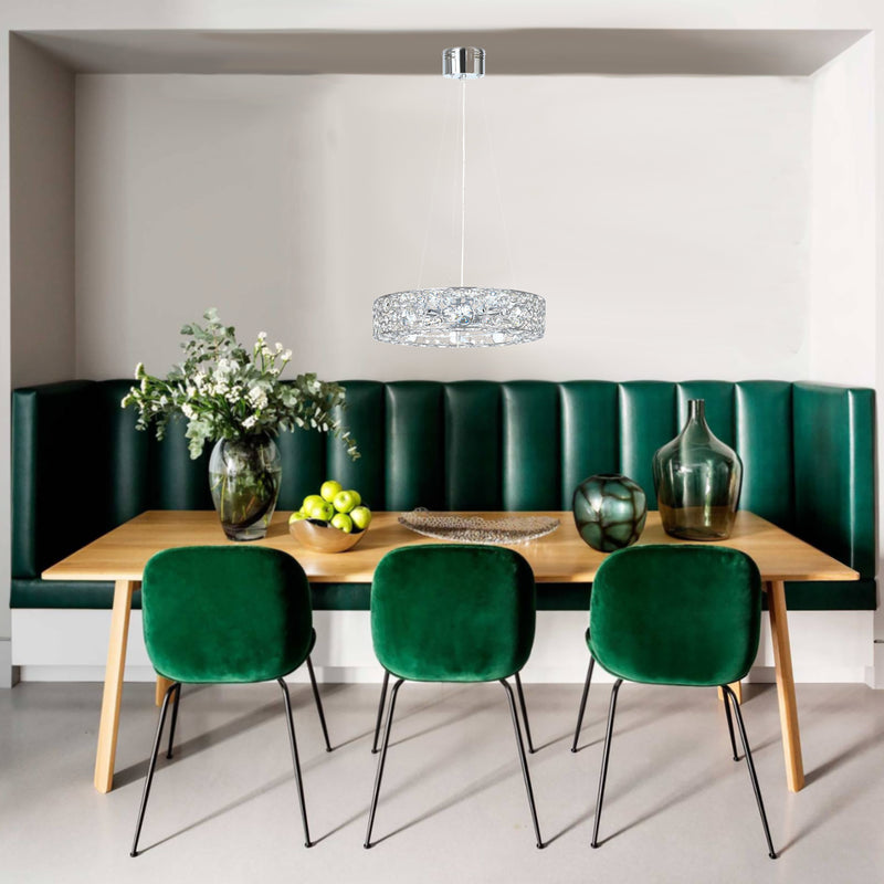 glass crystal pendant light in a luxury dining booth with velvet dining chairs