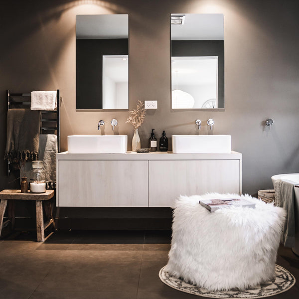 luxury faux fur lush pouf ottoman styled in a modern bathroom with character finishes.