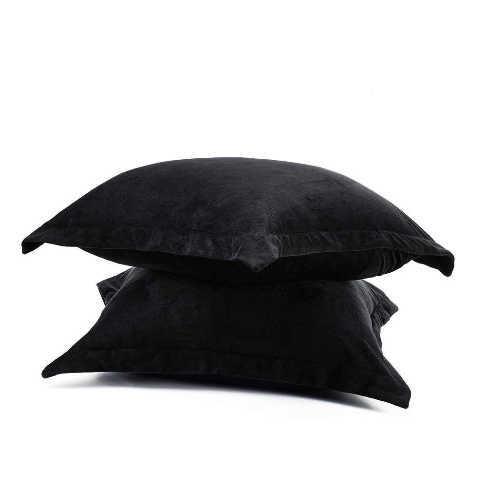 velvet fur pillowcase stacked on top of each other on a white background