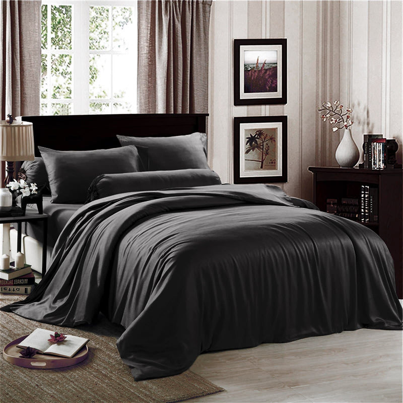 beautiful  and soft black quilt cover on an elegant bed with white windows