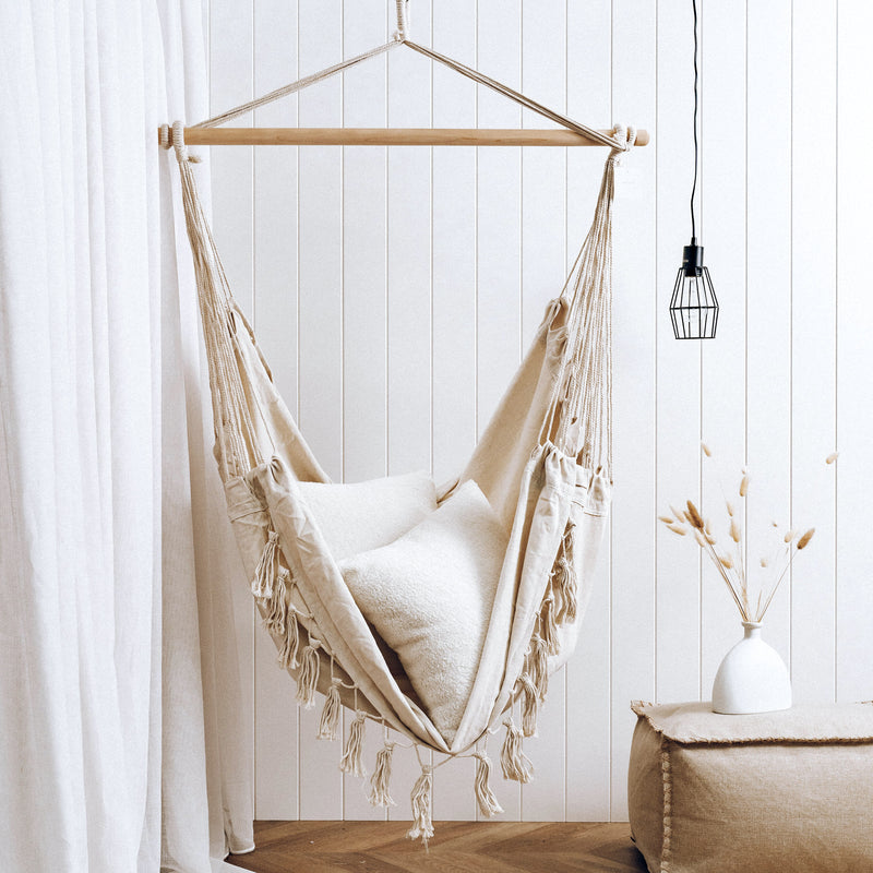 cream hammock hanging in a modern living room