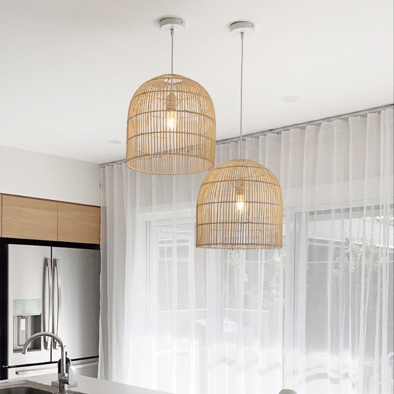 Natural Cane Pendant Lights hanging over a white kitchen island