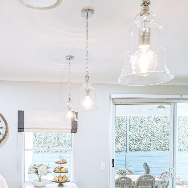 chrome pendant light hanging in a luxe hamptons kitchen
