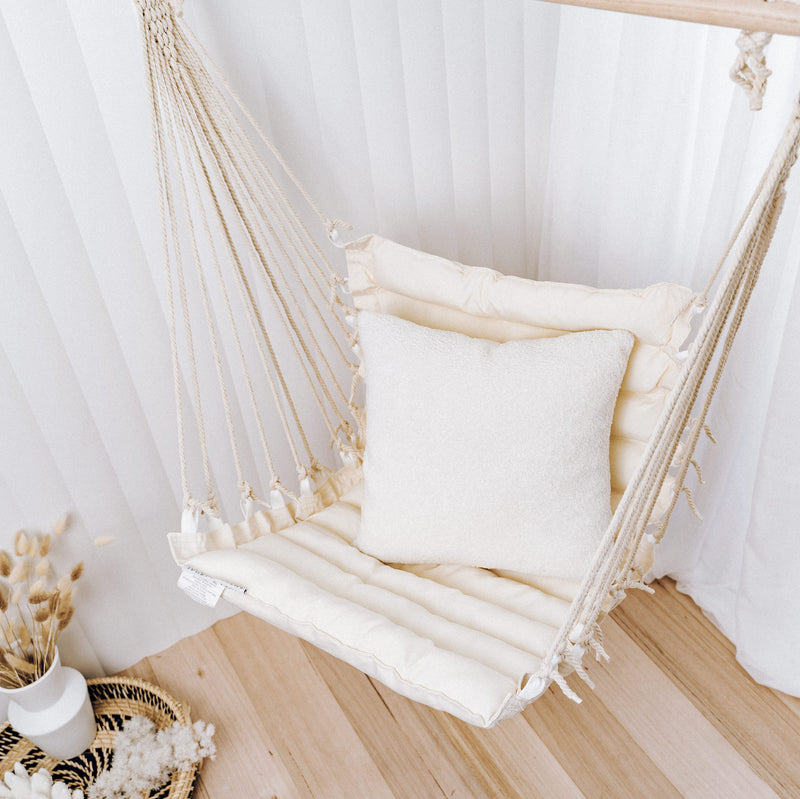 padded macrame rope hammock chair in an living room