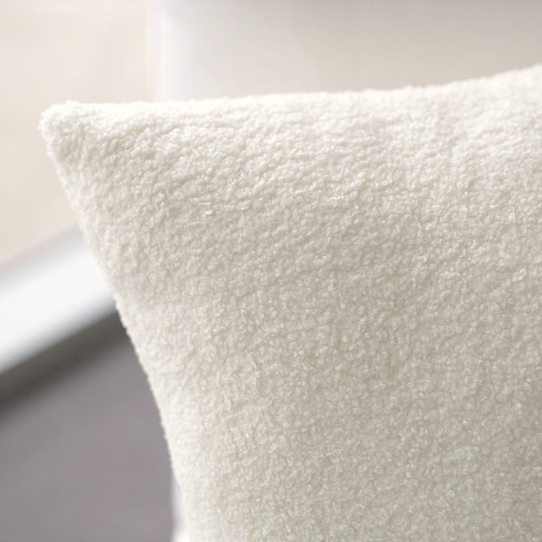 White Boucle Cushion: A soft and textured cushion featuring boucle fabric in a french white color, perfect for adding elegance, comfort, and versatility to any seating or bedding arrangement.