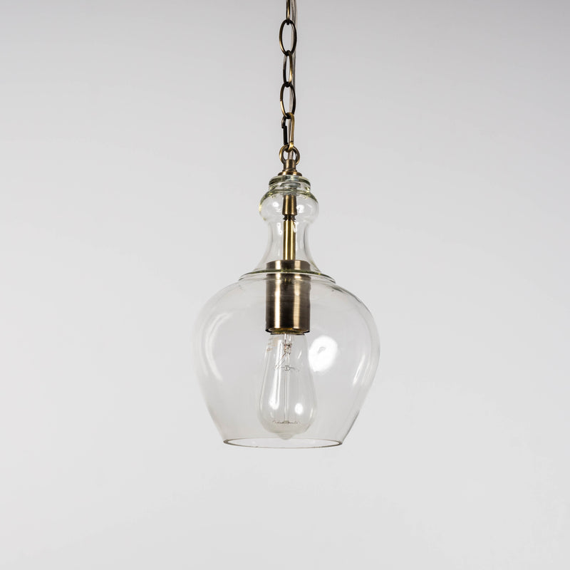 Glass pendant light hanging from ceiling