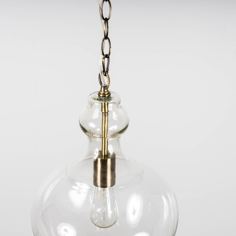 Glass pendant light hanging from ceiling