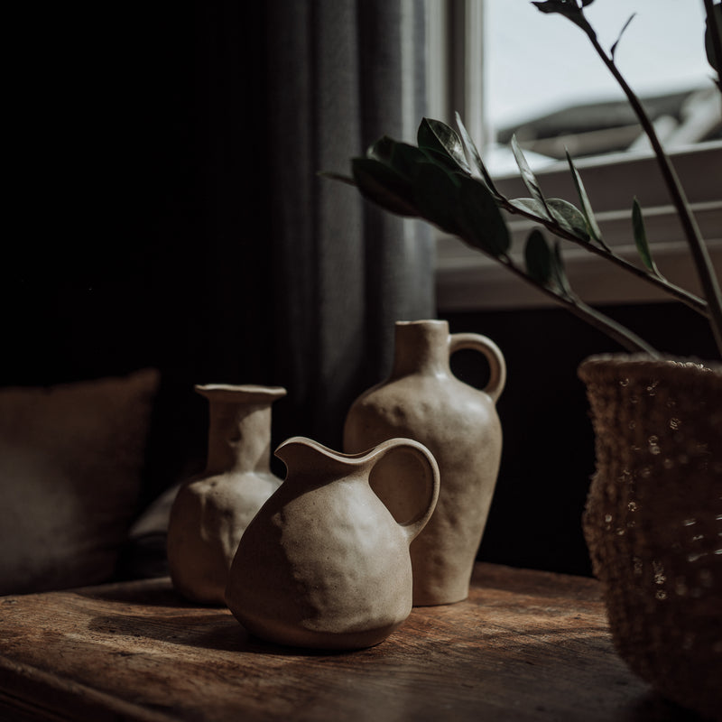 clay ceramic vase vessels on an old wooden table