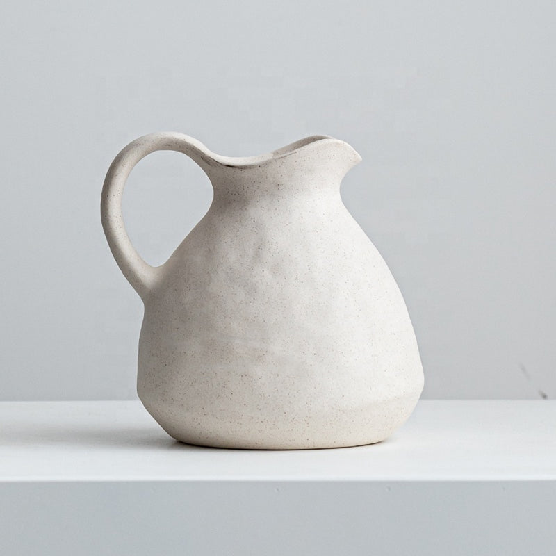 jug vase vessel on a white shelf
