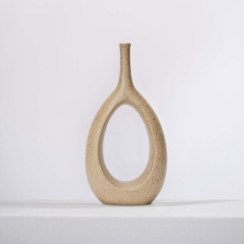 modern clay ceramic vase on a white shelf
