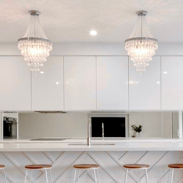 olivia pendant chandelier hanging in a modern white kitchen