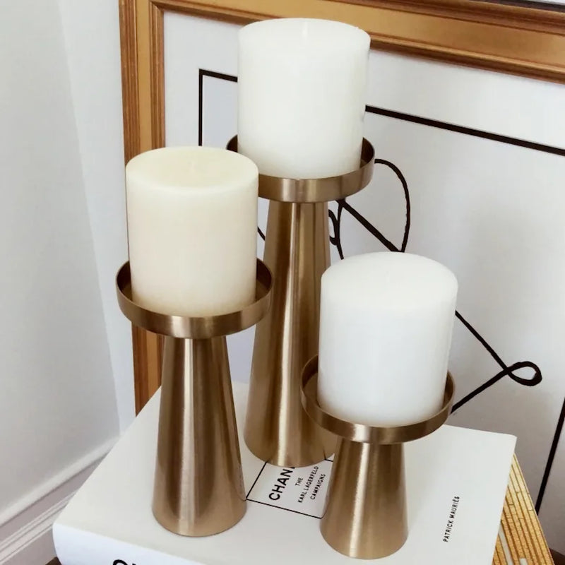 brushed gold tapered pillar candle holder suitable for large candles