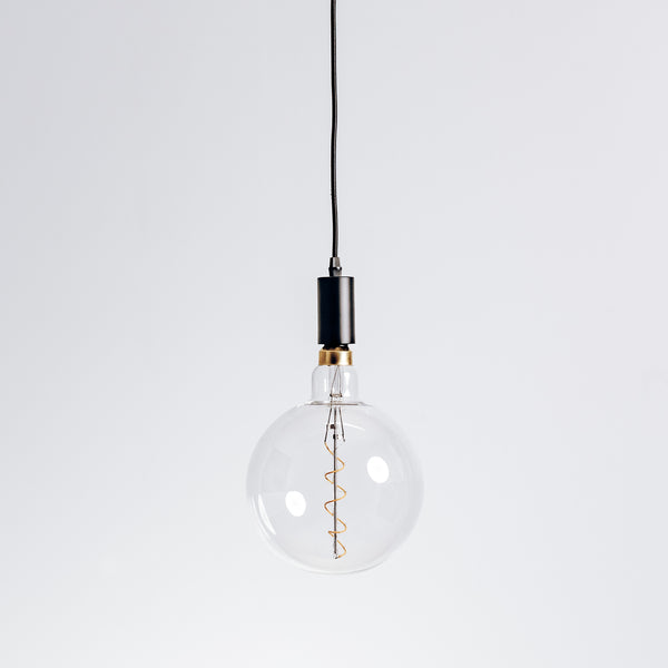 Contemporary pendant light fixture with matt black finish hanging from ceiling.