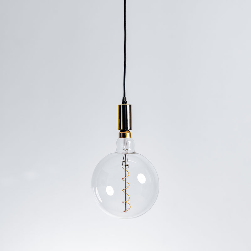 Contemporary pendant light fixture with polished gold finish hanging from ceiling.