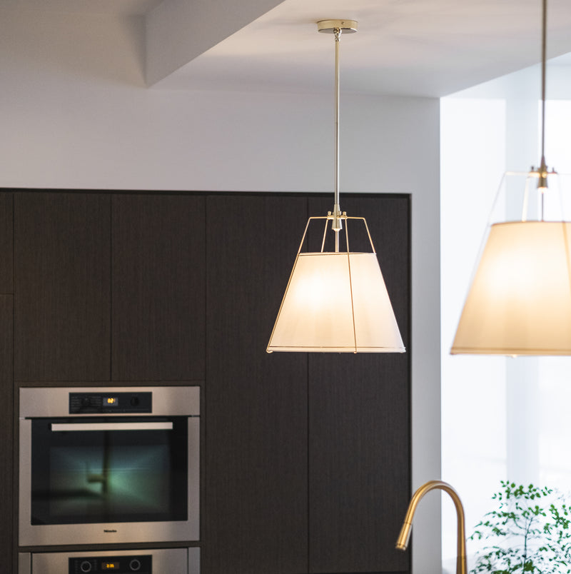 jessie pendant light with gold fittings and white shade in a modern kitchen