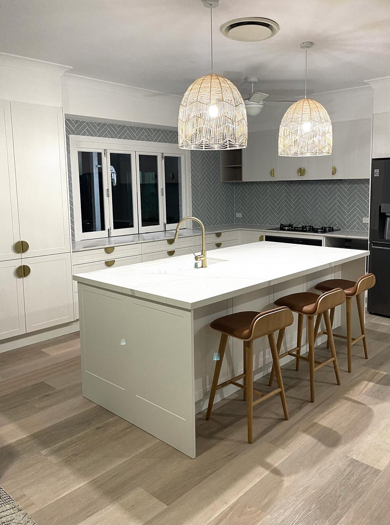 natural amalfi pendant lights in a modern organic kitchen with gold hardware