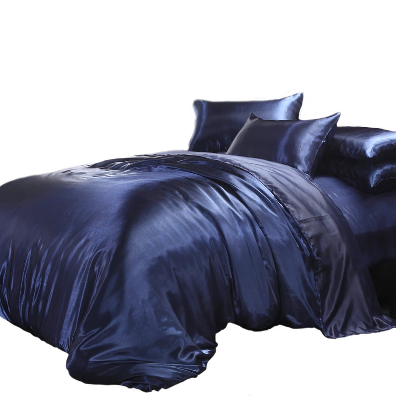 satin quilt cover navy blue with pillows on a white background