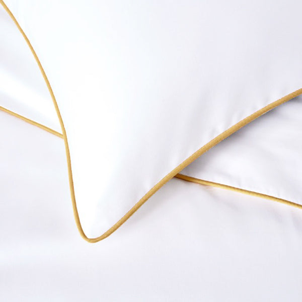 white pillowcases with gold piping edging trim